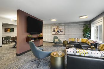 A living room filled with furniture and a television